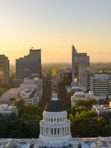 Captivating aerial view of Sacramento's skyline with the California Capitol at golden hour.