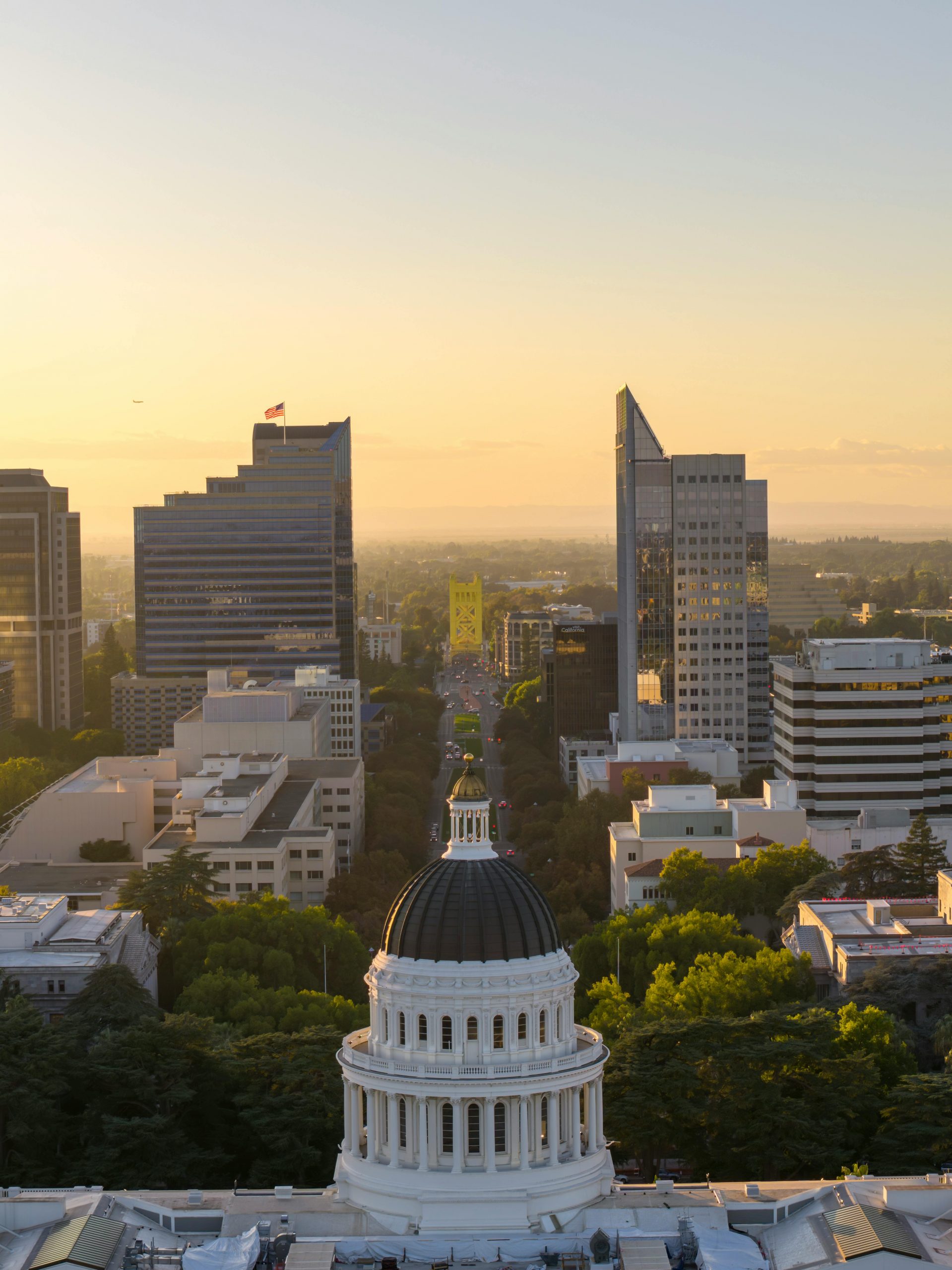 Captivating aerial view of Sacramento's skyline with the California Capitol at golden hour.